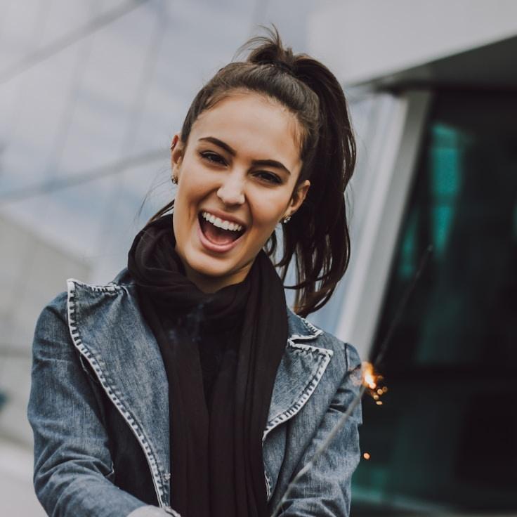 Avery Chen, Lead Design Curator at RiverBankStudio, reviewing corporate floral arrangements